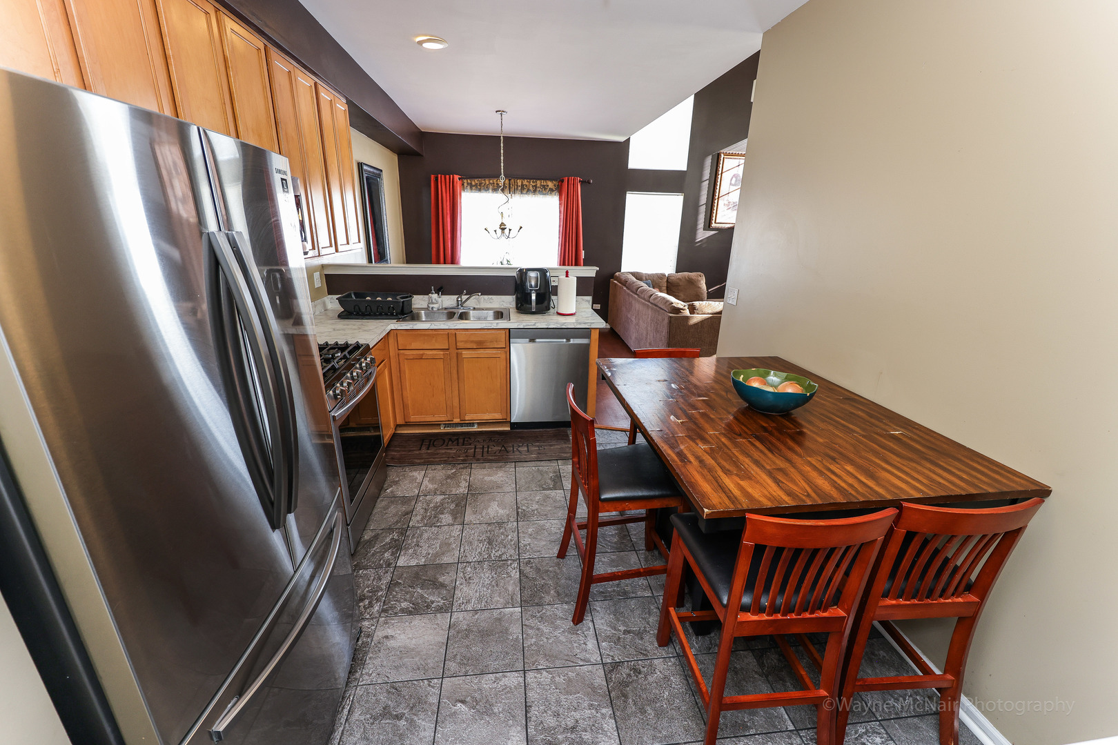 195 Key Largo Drive Romeoville, IL 60446 - Photo 15 of 34 a view of a kitchen with furniture and a window