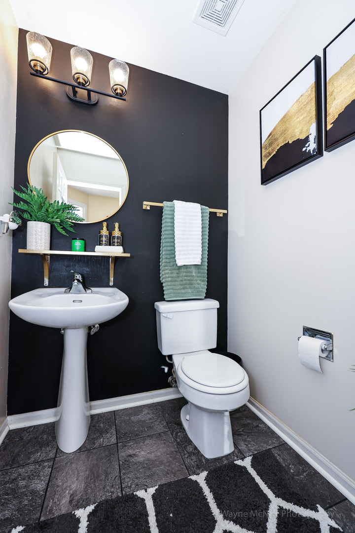 195 Key Largo Drive Romeoville, IL 60446 - Photo 16 of 34 a bathroom with a sink toilet and a mirror