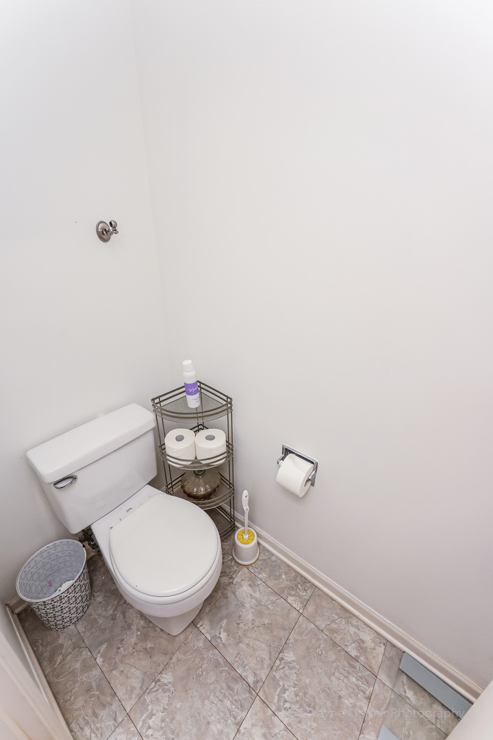 195 Key Largo Drive Romeoville, IL 60446 - Photo 22 of 34 a white toilet sitting next to a white wall