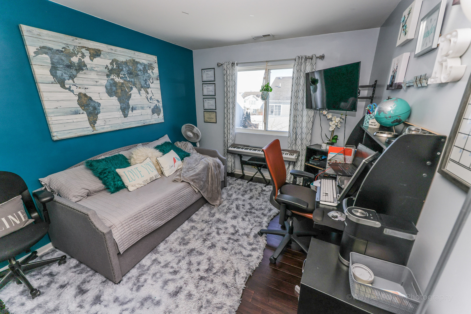 195 Key Largo Drive Romeoville, IL 60446 - Photo 23 of 34 a living room with furniture a flat screen tv and a large window