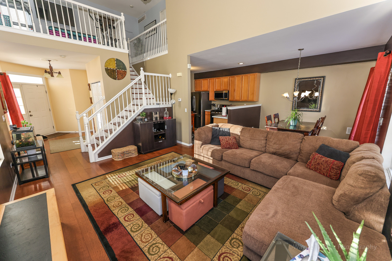 195 Key Largo Drive Romeoville, IL 60446 - Photo 7 of 34 a living room with furniture a rug and a chandelier