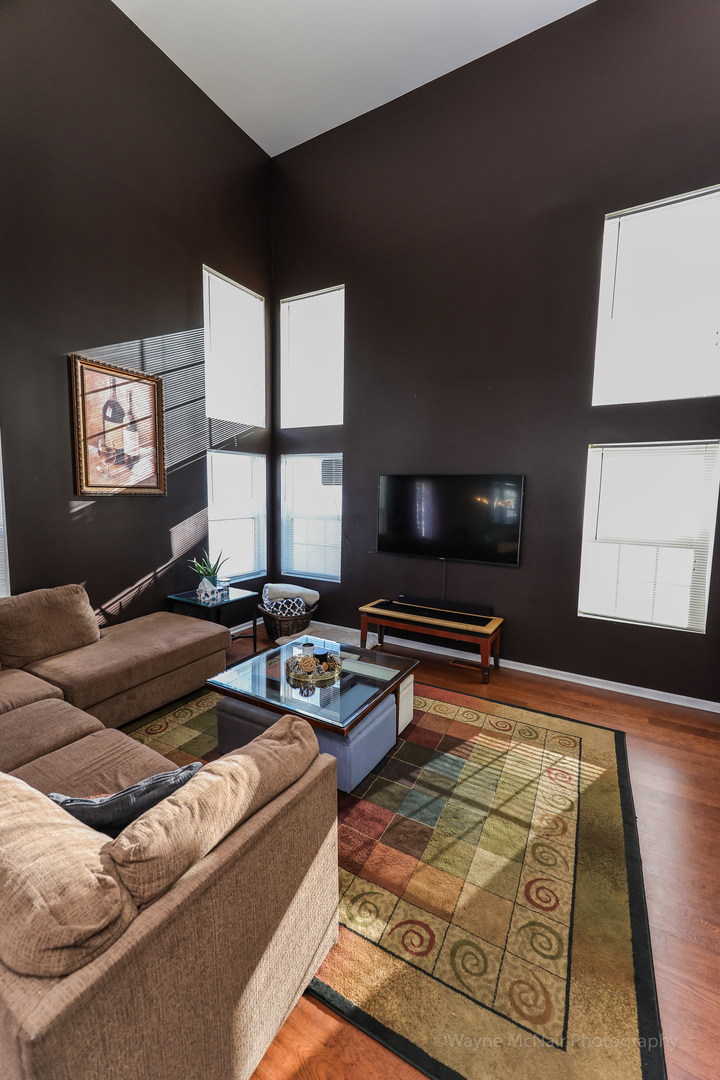 195 Key Largo Drive Romeoville, IL 60446 - Photo 9 of 34 a living room with furniture and a flat screen tv