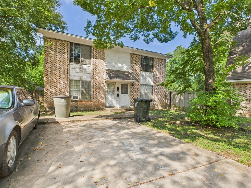 749 Meadow Lane Bryan, TX 77802 - Photo 20 of 47 a view of a house with a yard