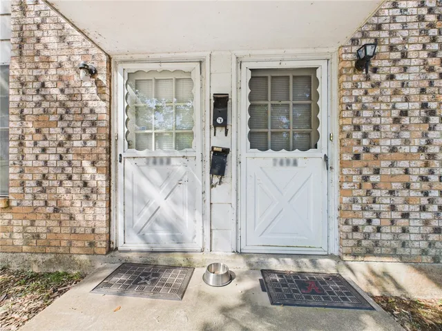 view of front door with outdoor space