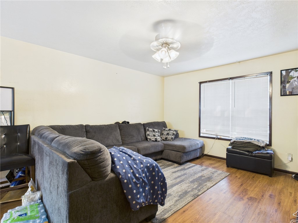 749 Meadow Lane Bryan, TX 77802 - Photo 24 of 47 a living room with furniture and a flat screen tv
