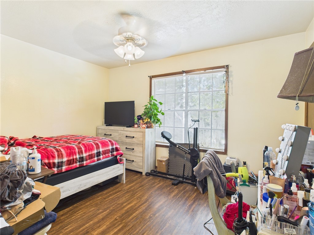 749 Meadow Lane Bryan, TX 77802 - Photo 33 of 47 a bedroom with bed and flat screen tv