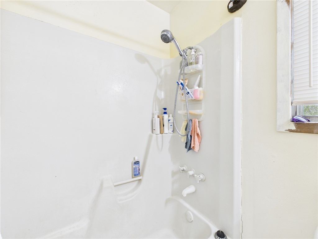 749 Meadow Lane Bryan, TX 77802 - Photo 39 of 47 a bathroom with a bathtub and a shower