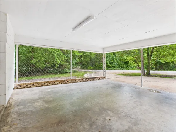 a view of an empty room with a large window