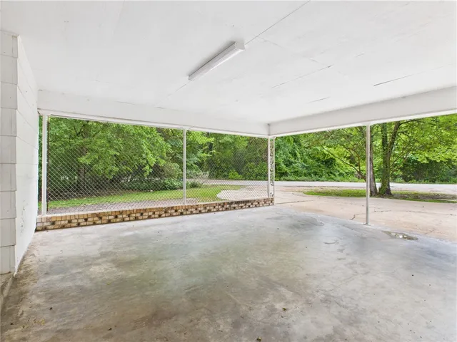 a view of an empty room with a large window