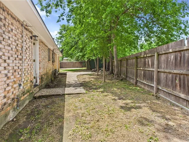 a view of backyard with tree