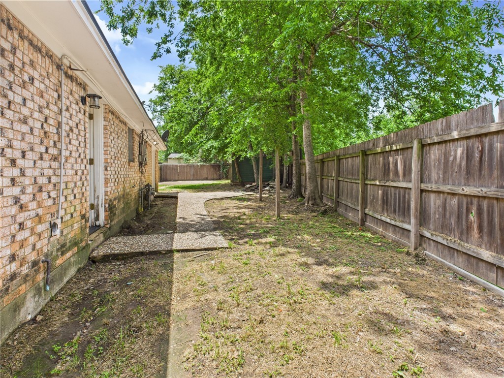 749 Meadow Lane Bryan, TX 77802 - Photo 43 of 47 a view of backyard with tree