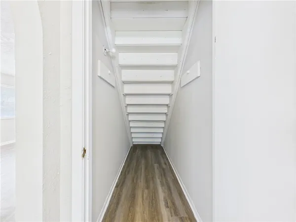 a view of a hallway with stairs