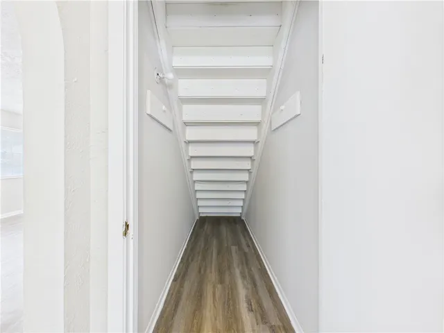 a view of a hallway with stairs