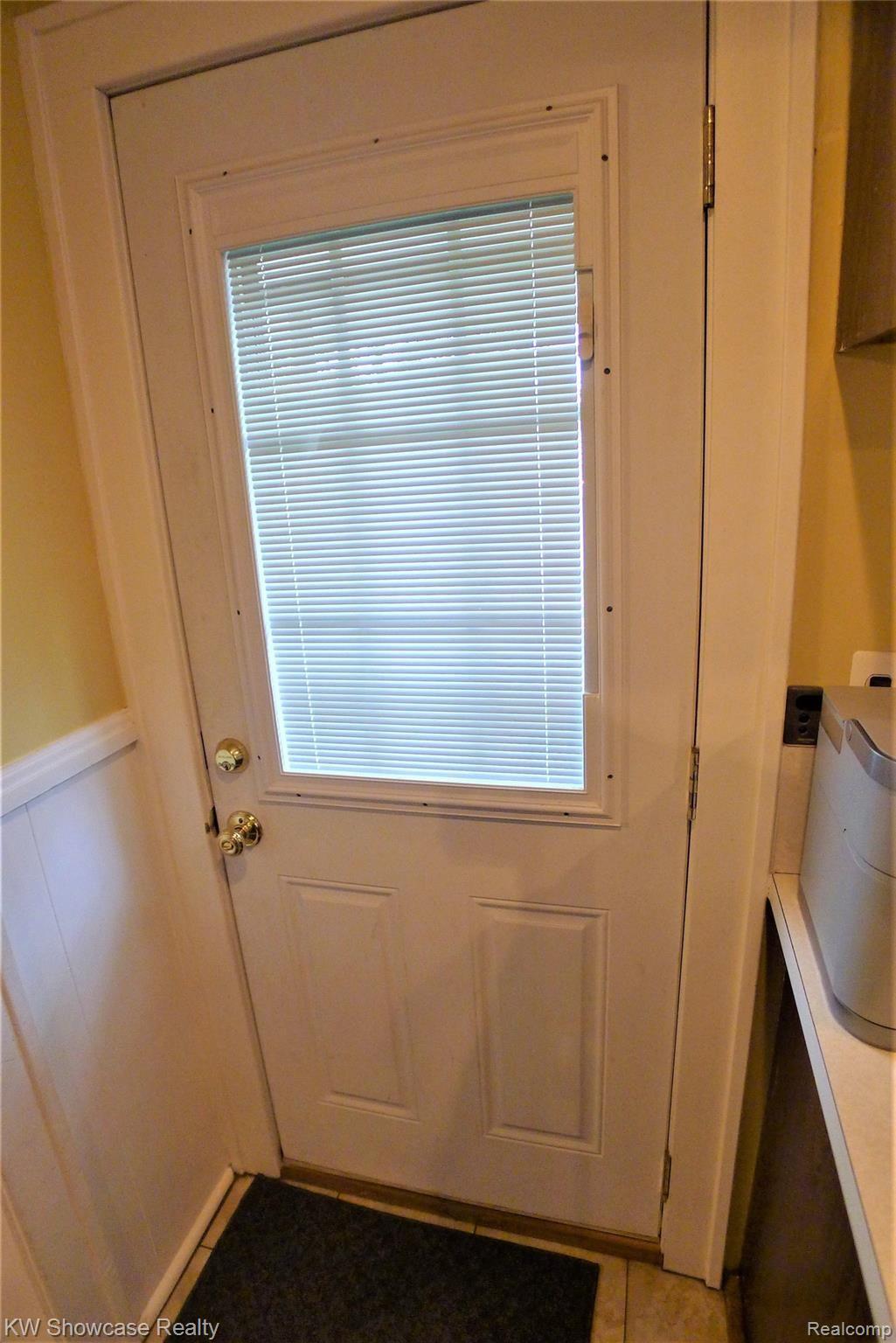 20934 Moross Road Grosse Pointe, MI 48236 - Photo 20 of 31 Rear newer entry door with built-in blind.
