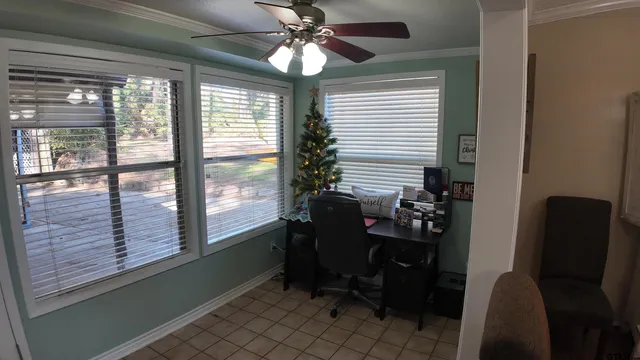 a dining room with furniture and window