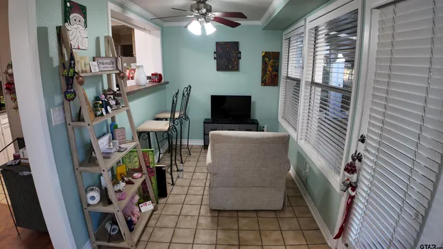 a view of living room with furniture and flat screen tv