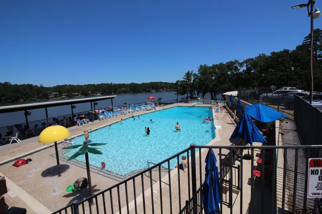 a view of a swimming pool with a deck and mountain view