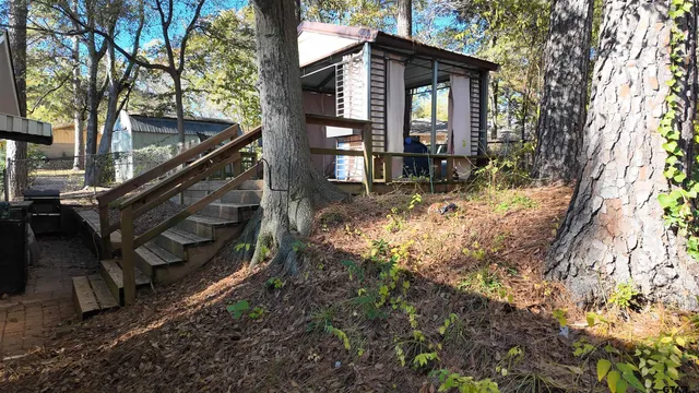 a view of a house with a yard covered with snow