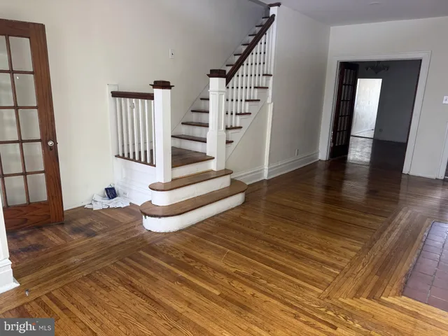 a view of entryway with wooden floor