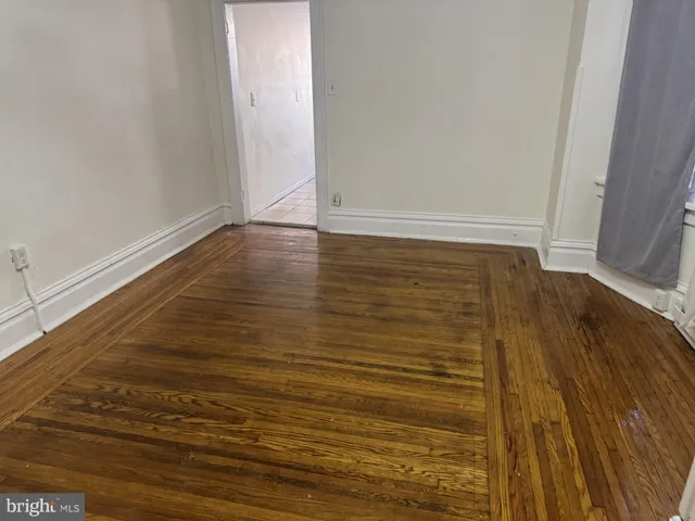 a view of room and wooden floor