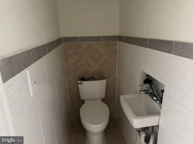 a bathroom with a toilet and a sink