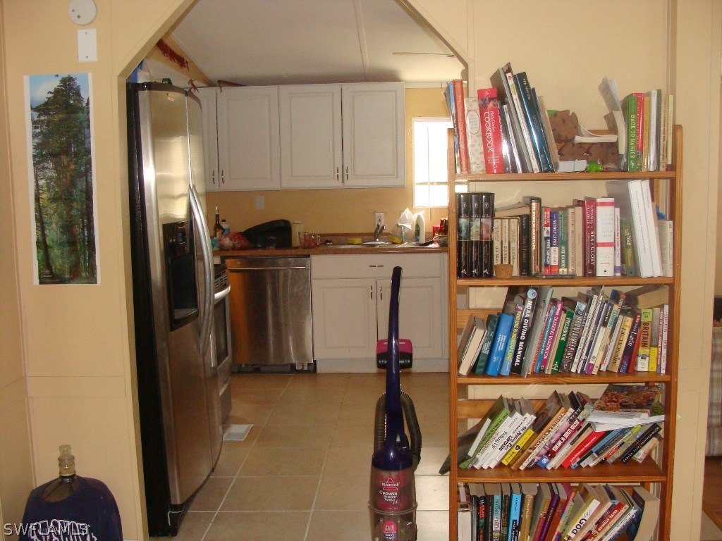 7421 Pinehurst Road Bokeelia, FL 33922 - Photo 7 of 21 a view of walk in closet with clothes and shoes
