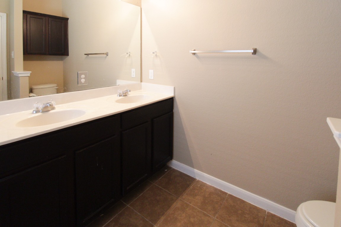 1508 Colton Lane Lockhart, TX 78644 - Photo 11 of 24 Double vanity in the primary bathroom