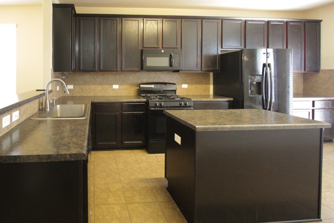 1508 Colton Lane Lockhart, TX 78644 - Photo 5 of 24 Kitchen with a kitchen island