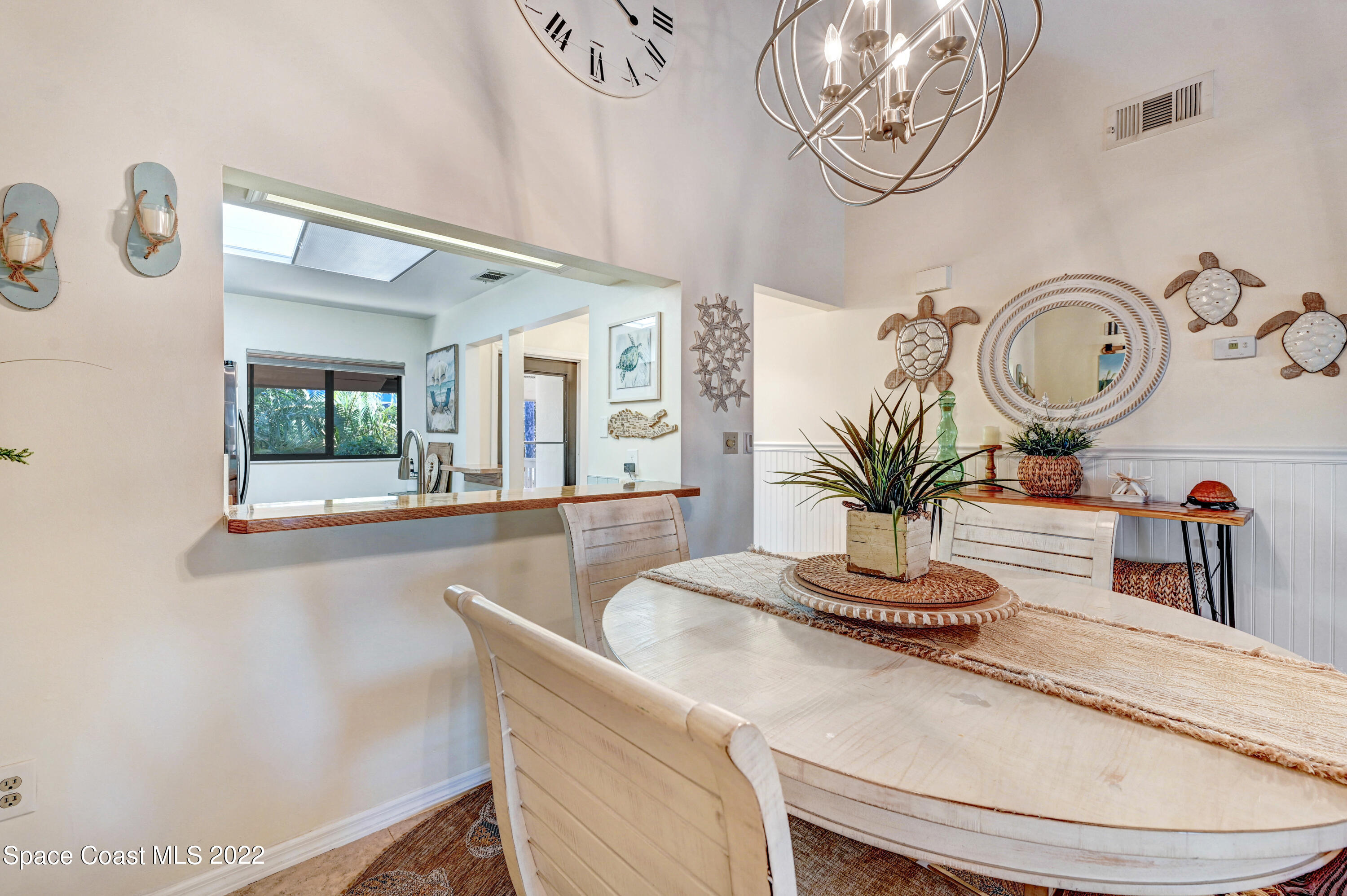 2929 Kirkland Road Northeast Palm Bay, FL 32905 - Photo 11 of 32 a dining room with wooden floor