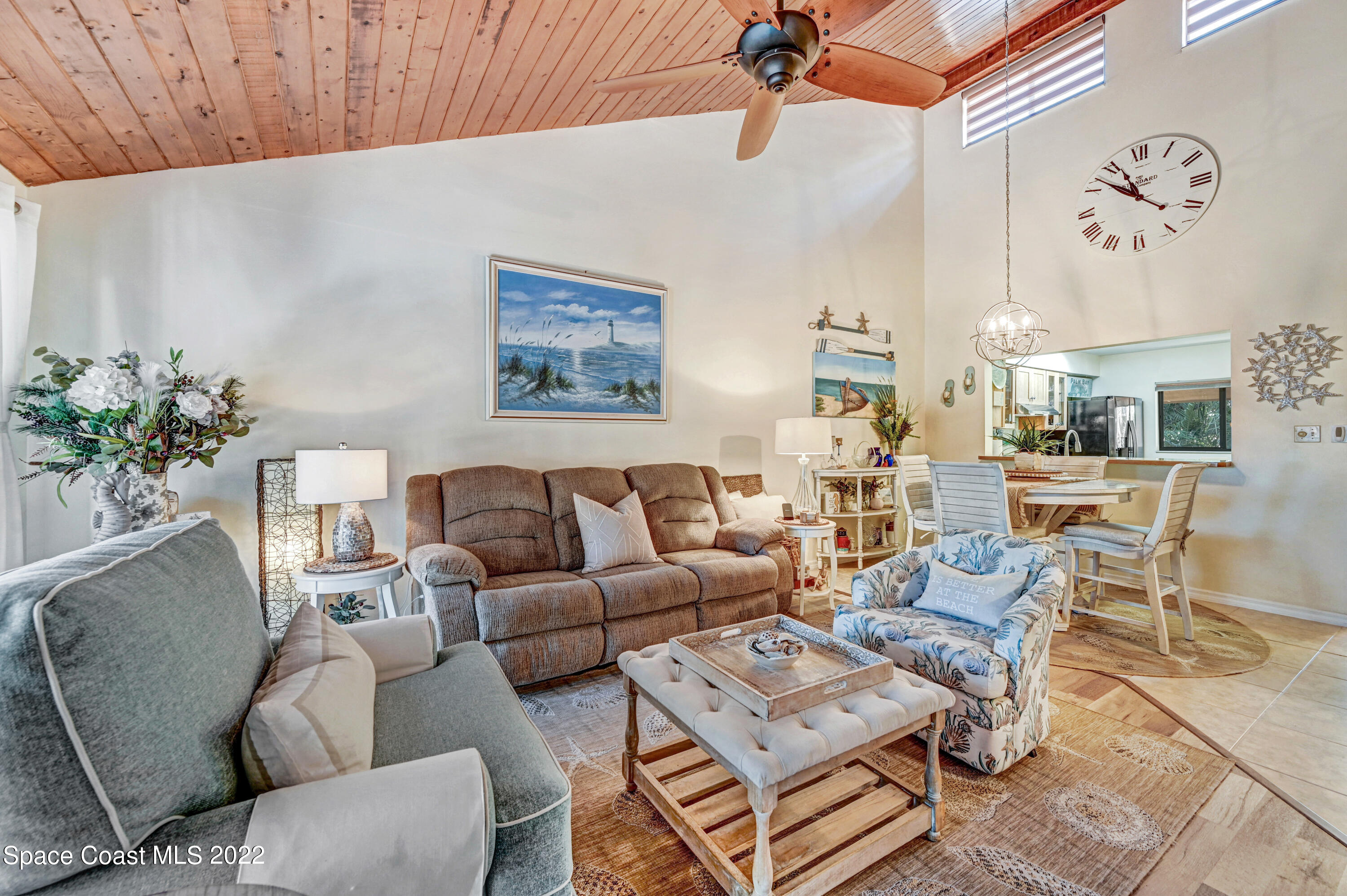2929 Kirkland Road Northeast Palm Bay, FL 32905 - Photo 14 of 32 a living room with furniture potted plant and a chandelier