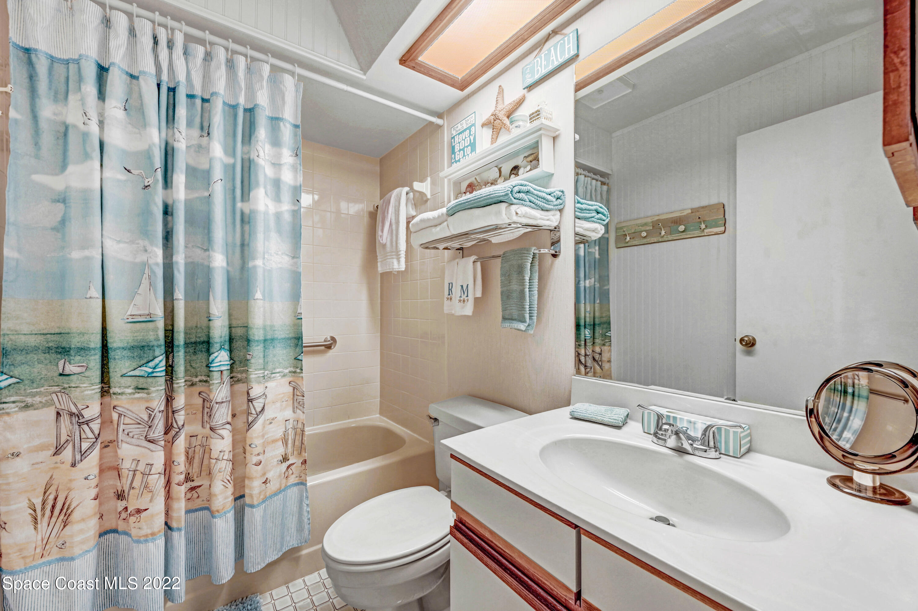 2929 Kirkland Road Northeast Palm Bay, FL 32905 - Photo 21 of 32 a bathroom with a sink toilet and shower