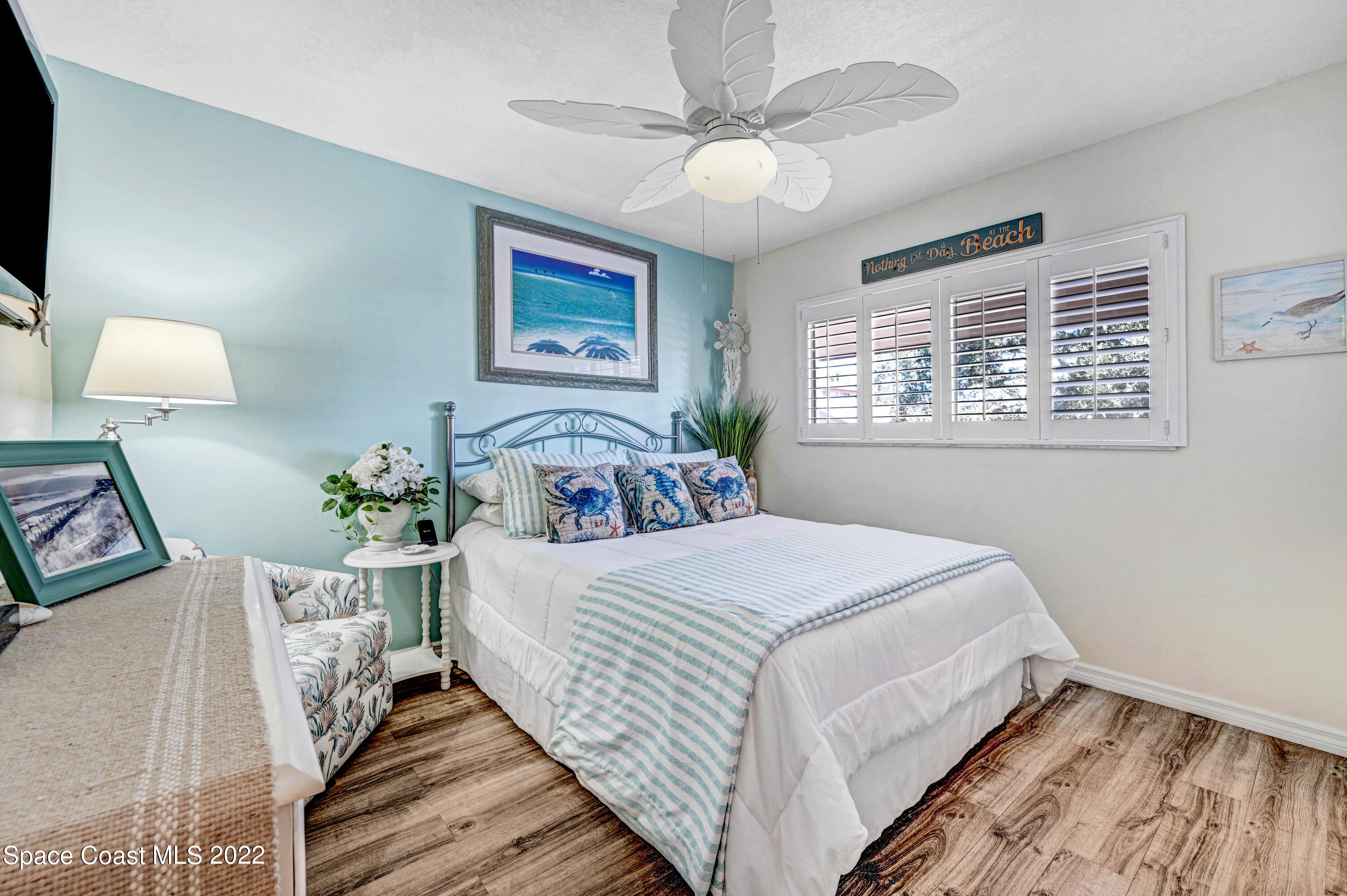 2929 Kirkland Road Northeast Palm Bay, FL 32905 - Photo 22 of 32 a bedroom with bed and window