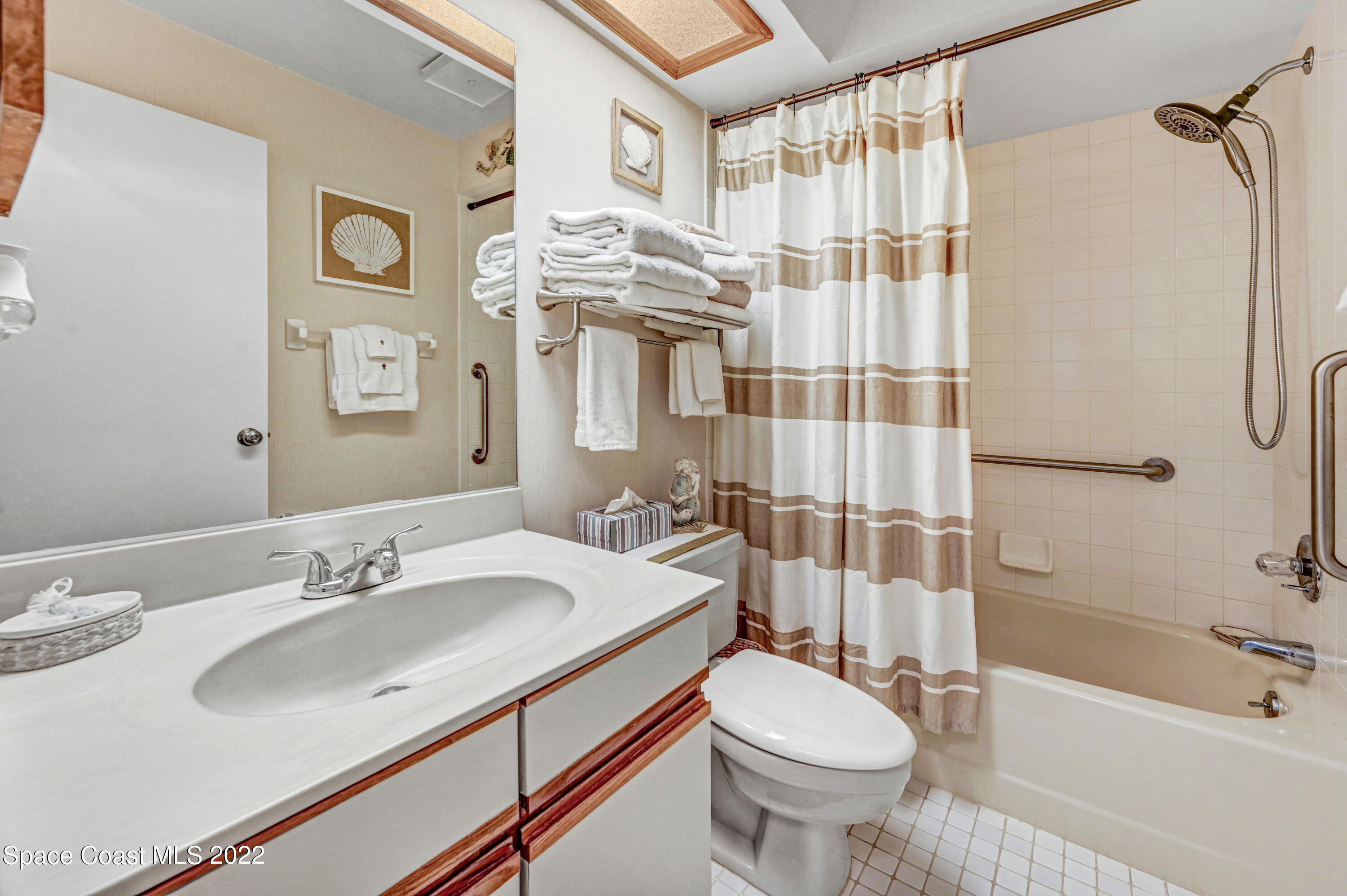 2929 Kirkland Road Northeast Palm Bay, FL 32905 - Photo 23 of 32 a bathroom with a sink toilet and shower