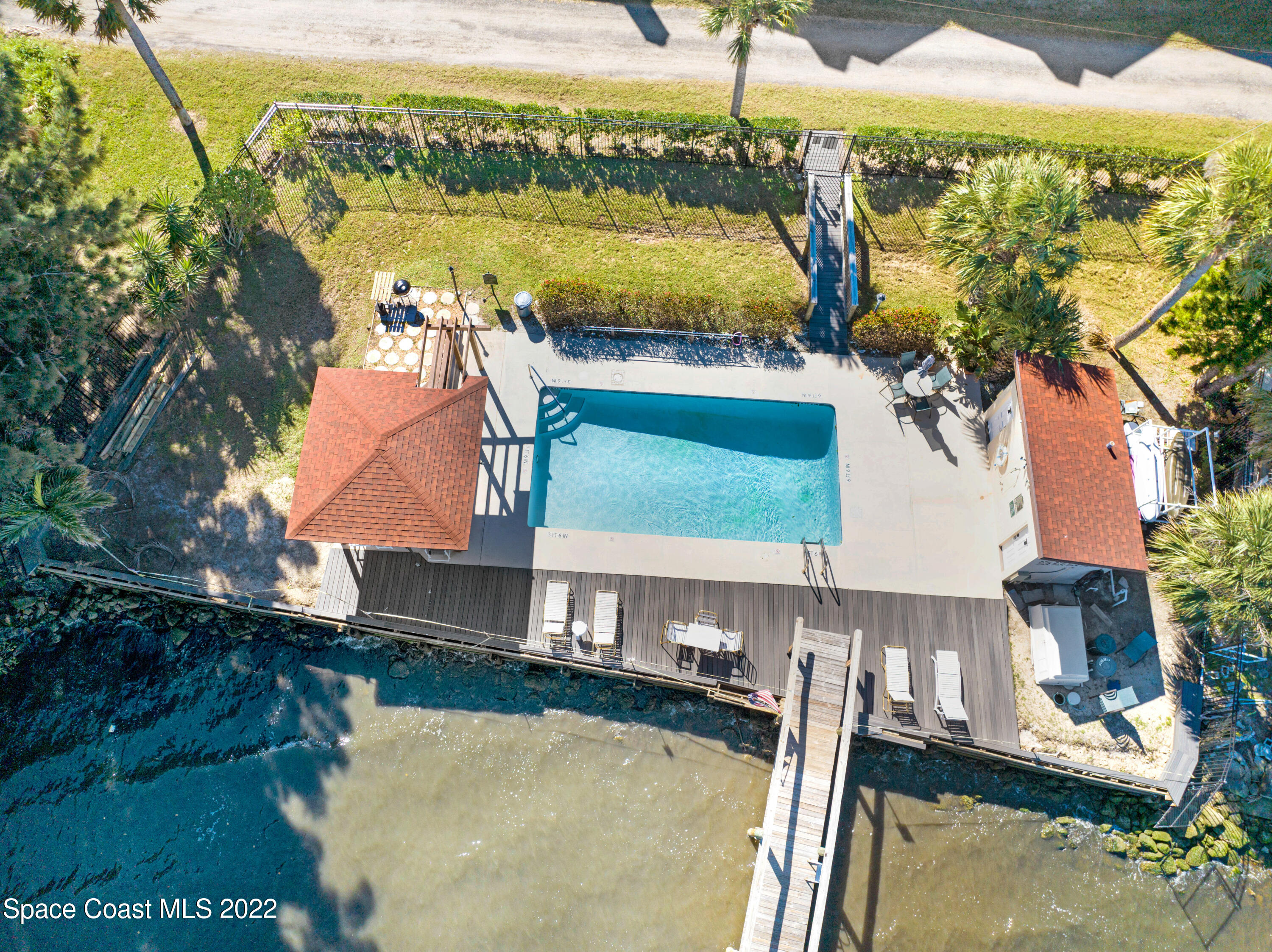 2929 Kirkland Road Northeast Palm Bay, FL 32905 - Photo 27 of 32 a view of a swimming pool with a patio