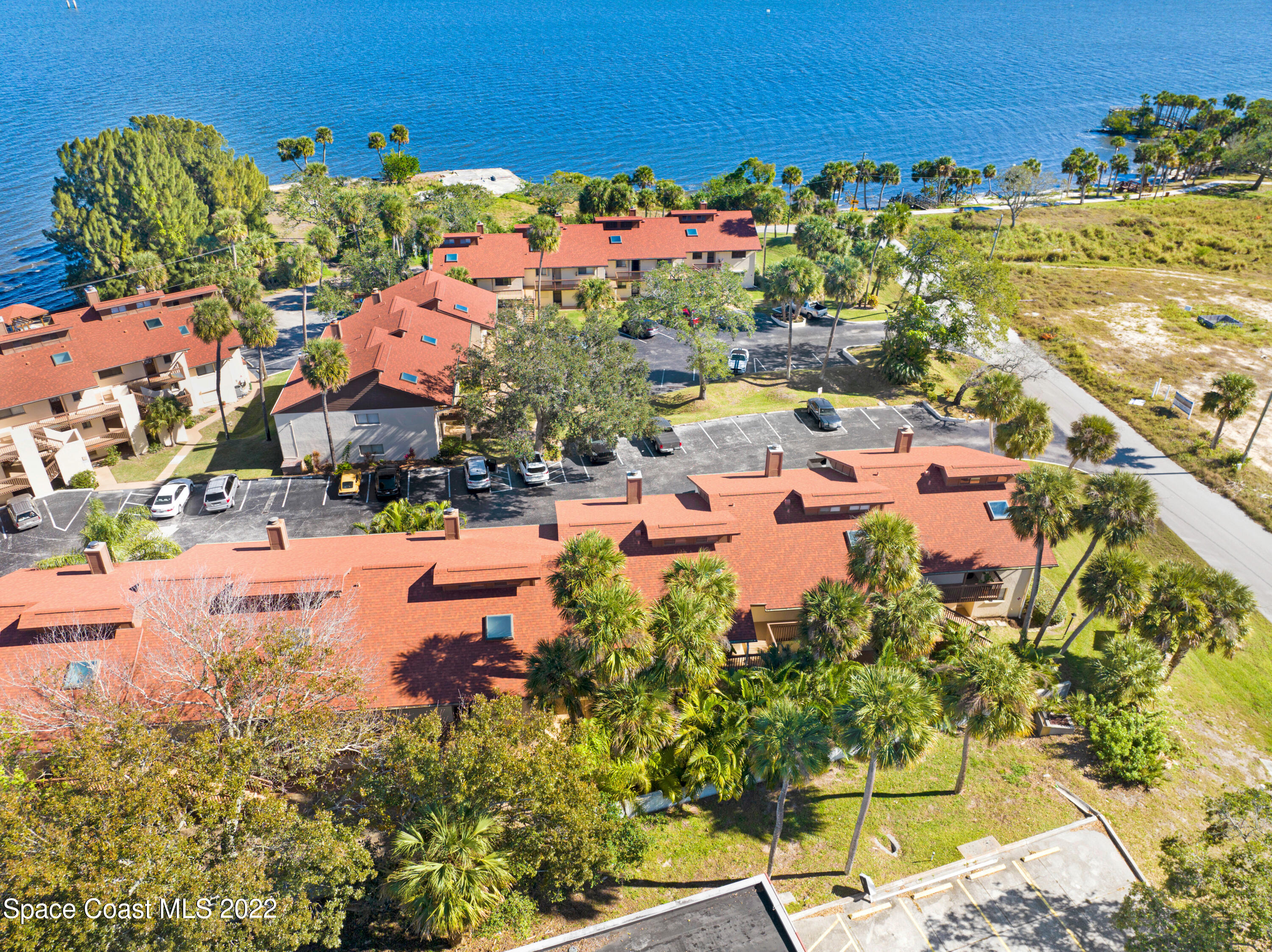 2929 Kirkland Road Northeast Palm Bay, FL 32905 - Photo 31 of 32 an aerial view of residential houses with outdoor space