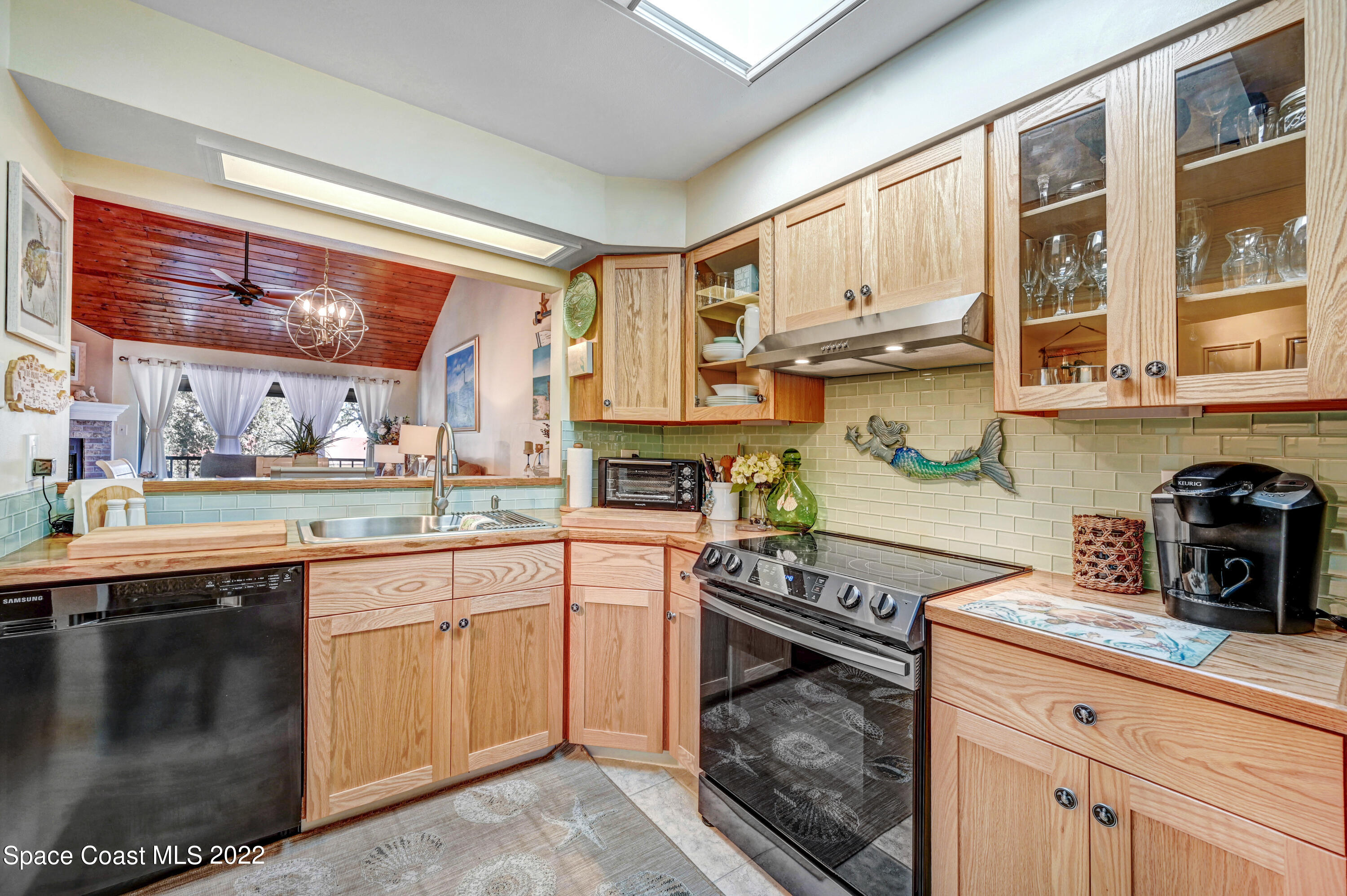 2929 Kirkland Road Northeast Palm Bay, FL 32905 - Photo 5 of 32 a kitchen with stainless steel appliances granite countertop a stove and a sink