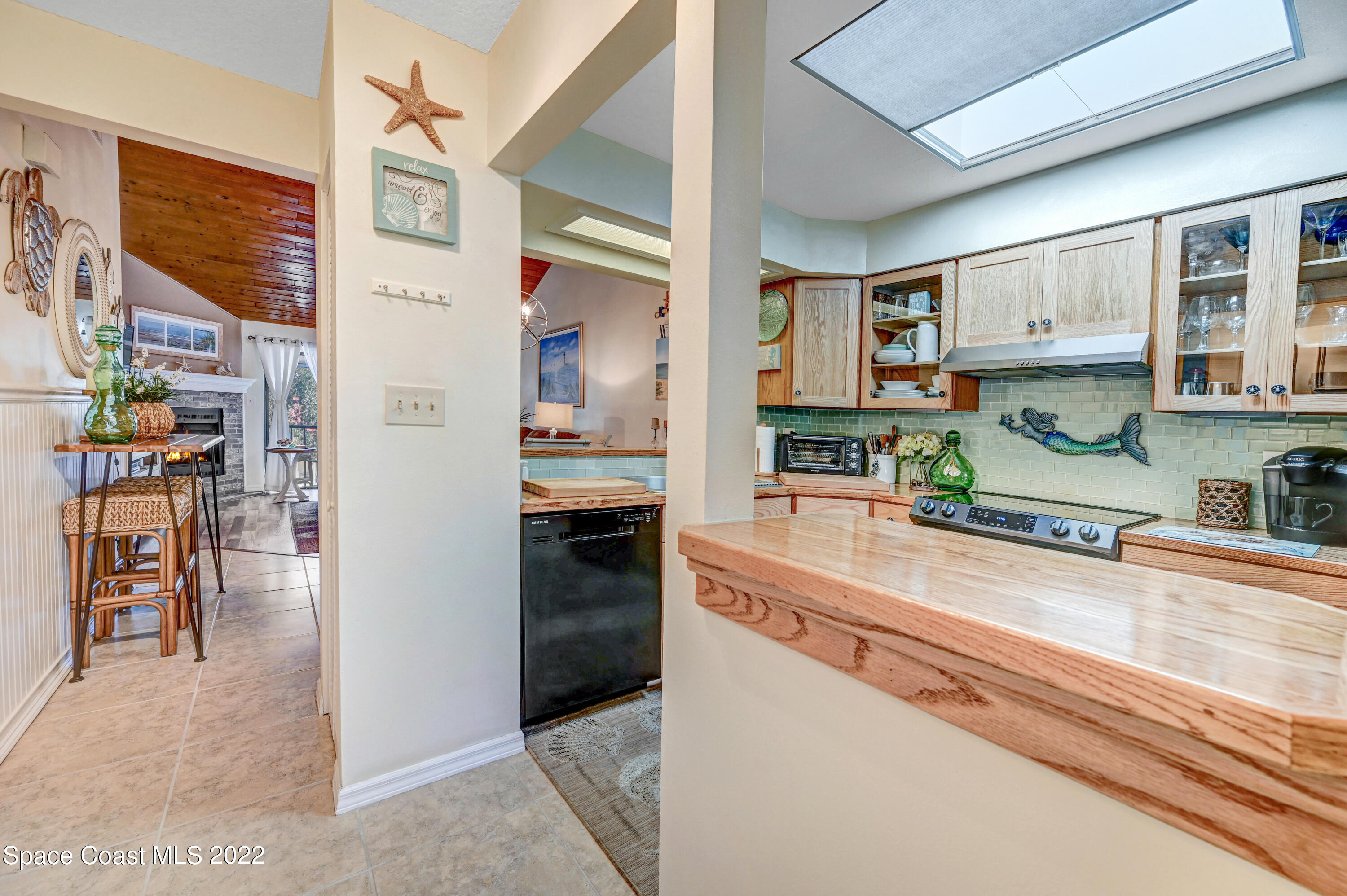 2929 Kirkland Road Northeast Palm Bay, FL 32905 - Photo 8 of 32 a kitchen view with stainless steel appliances granite countertop a refrigerator and a sink