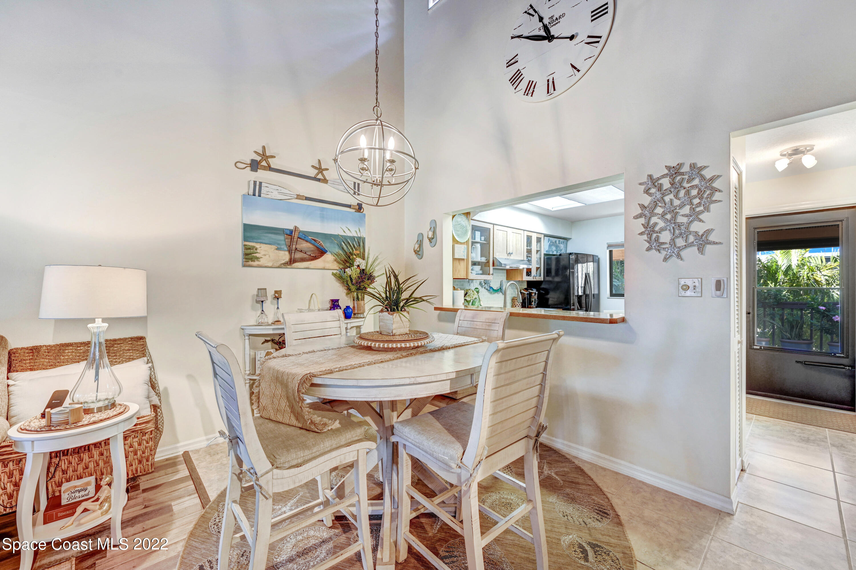 2929 Kirkland Road Northeast Palm Bay, FL 32905 - Photo 10 of 32 a view of a dining room with furniture and chandelier
