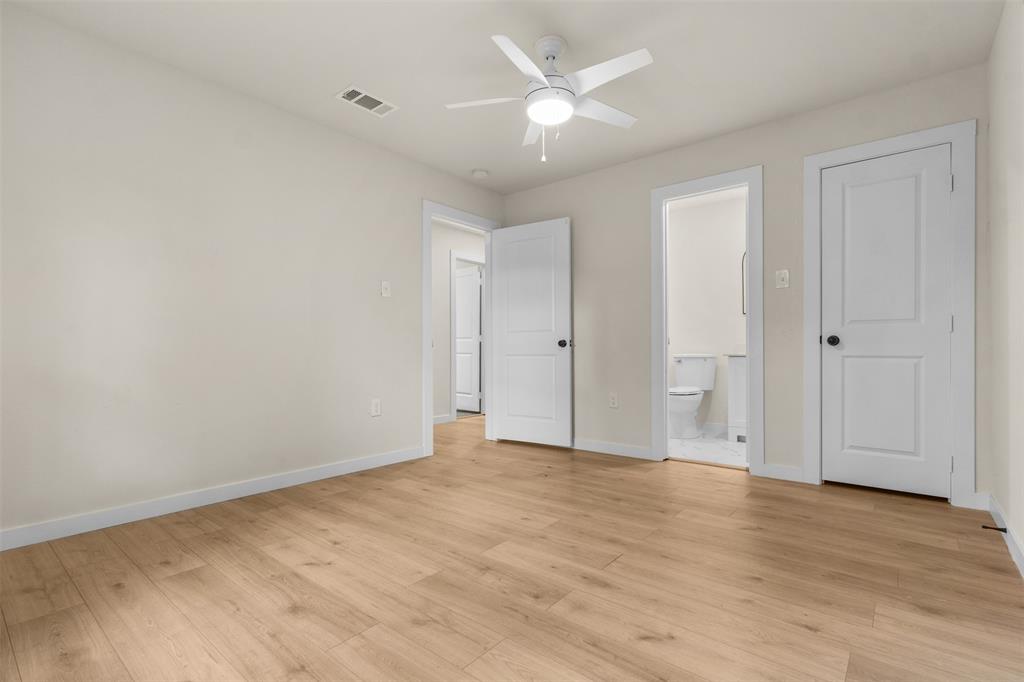 3915 Coolidge Street Dallas, TX 75215 - Photo 17 of 33 a view of an empty room with wooden floor