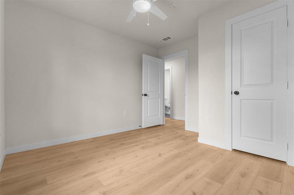 3915 Coolidge Street Dallas, TX 75215 - Photo 23 of 33 a view of an empty room with wooden floor