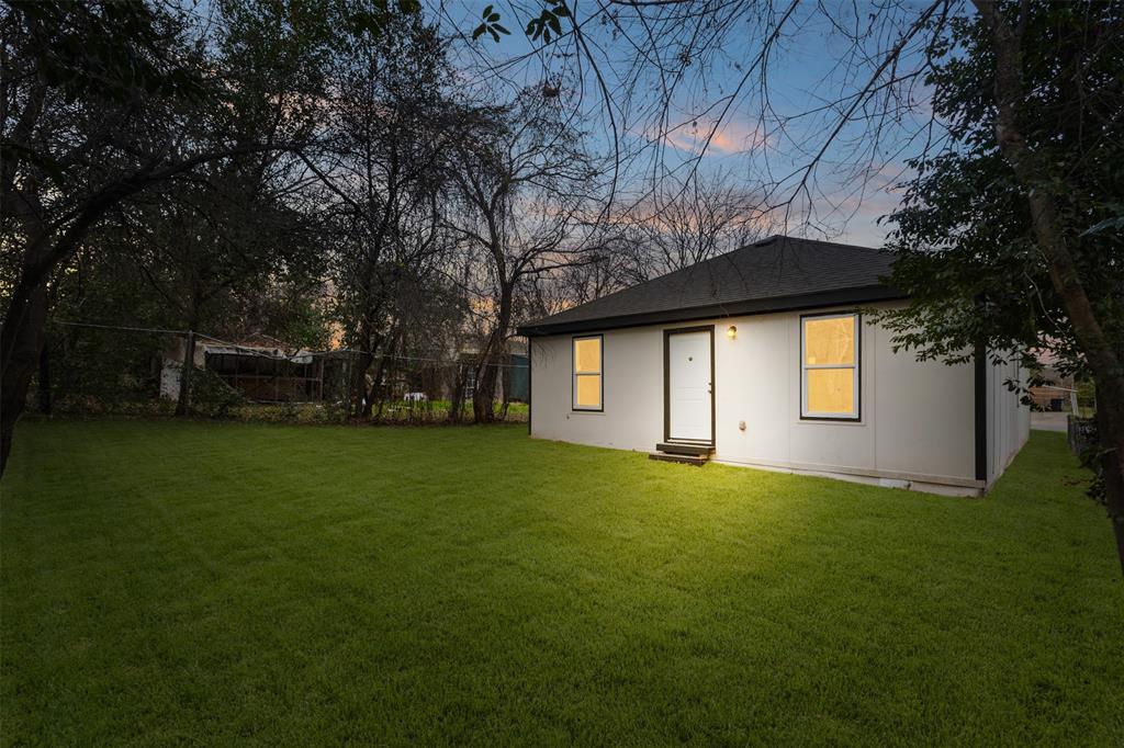 3915 Coolidge Street Dallas, TX 75215 - Photo 28 of 33 a front view of a house with garden