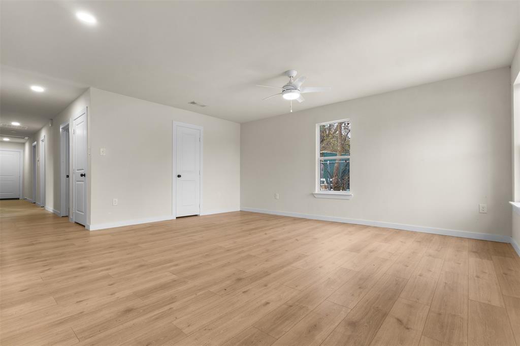 3915 Coolidge Street Dallas, TX 75215 - Photo 6 of 33 a view of an empty room with wooden floor