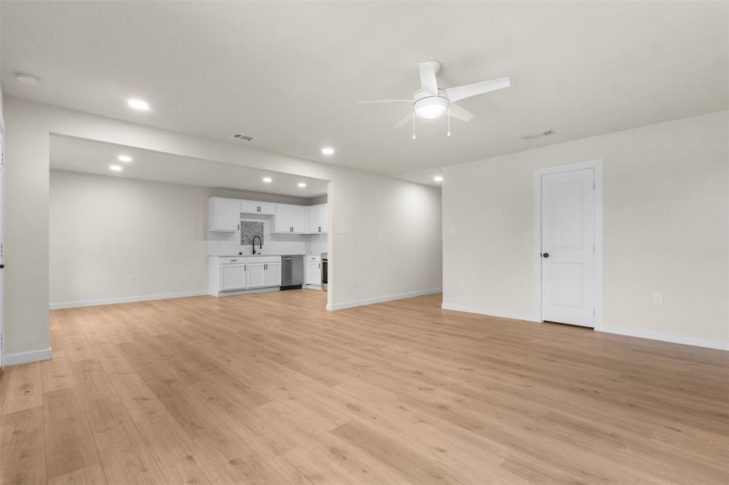3915 Coolidge Street Dallas, TX 75215 - Photo 7 of 33 a view of empty room with wooden floor