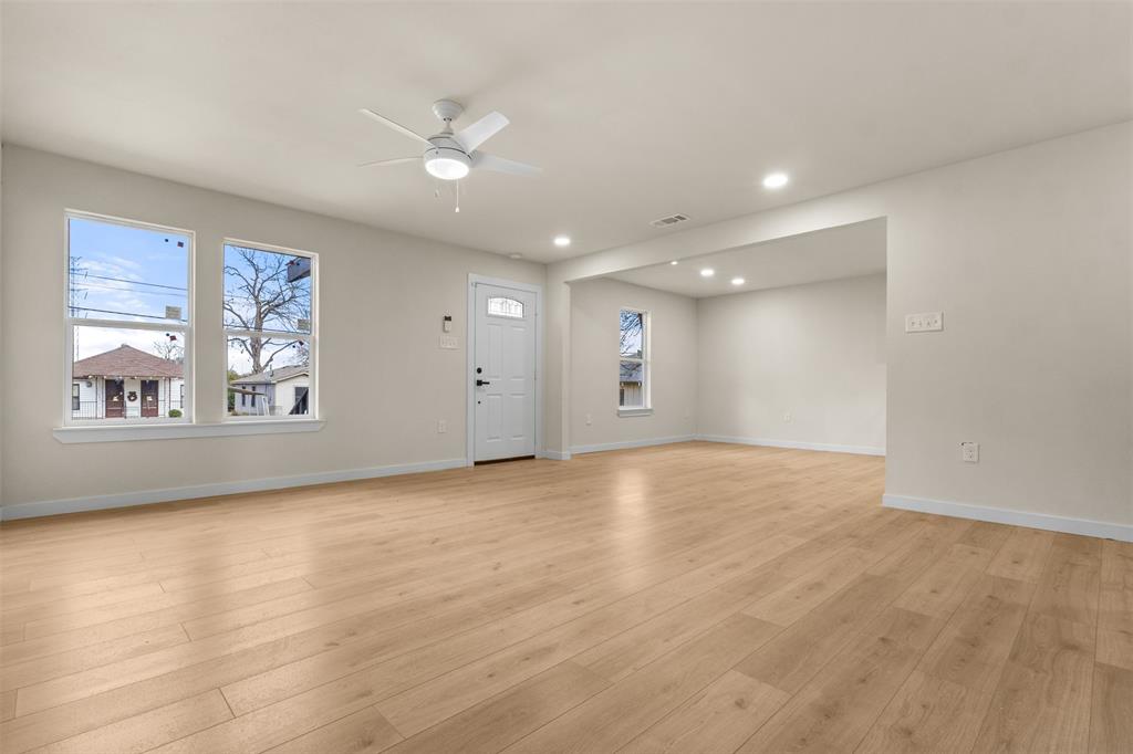 3915 Coolidge Street Dallas, TX 75215 - Photo 8 of 33 wooden floor in an empty room with a window
