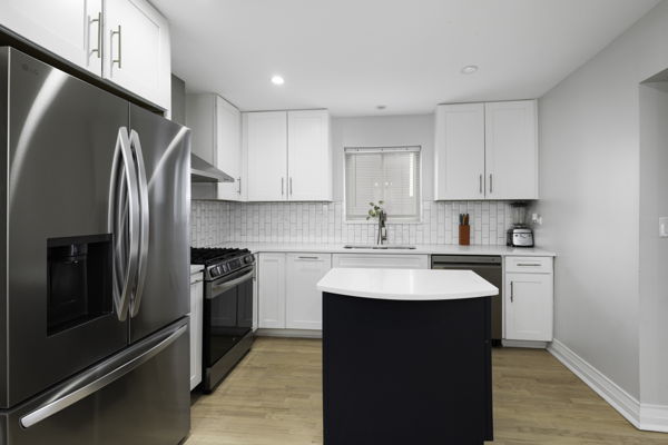 2623 North Rhodes Avenue River Grove, IL 60171 - Photo 4 of 17 a kitchen with stainless steel appliances granite countertop a refrigerator sink and stove
