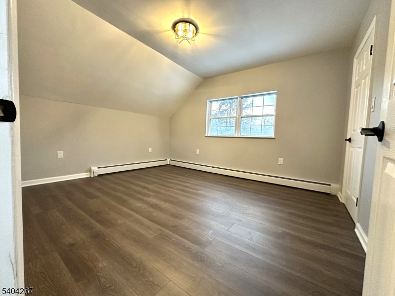 236 Kinnelon Road Kinnelon, NJ 07405 - Photo 14 of 22 an empty room with wooden floor and windows