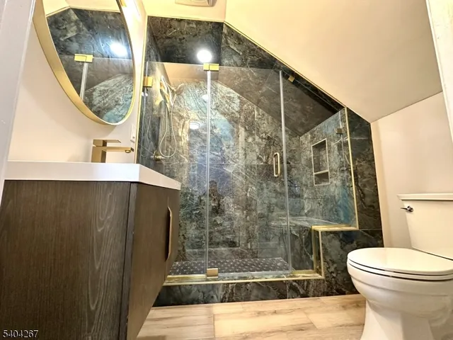 a bathroom with a mirror a sink and a mirror