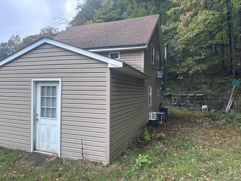 236 Kinnelon Road Kinnelon, NJ 07405 - Photo 17 of 22 a view of a small house and a yard