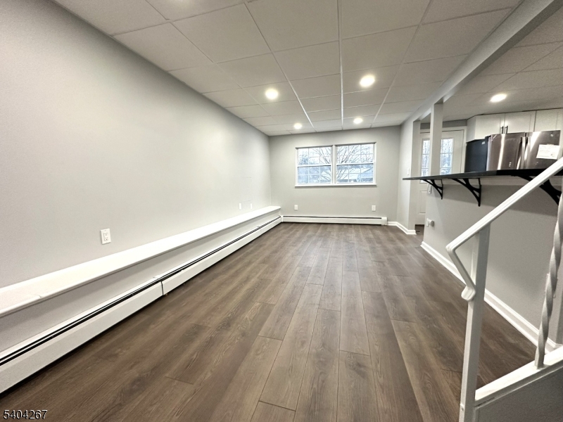 236 Kinnelon Road Kinnelon, NJ 07405 - Photo 6 of 22 an empty room with wooden floor and windows