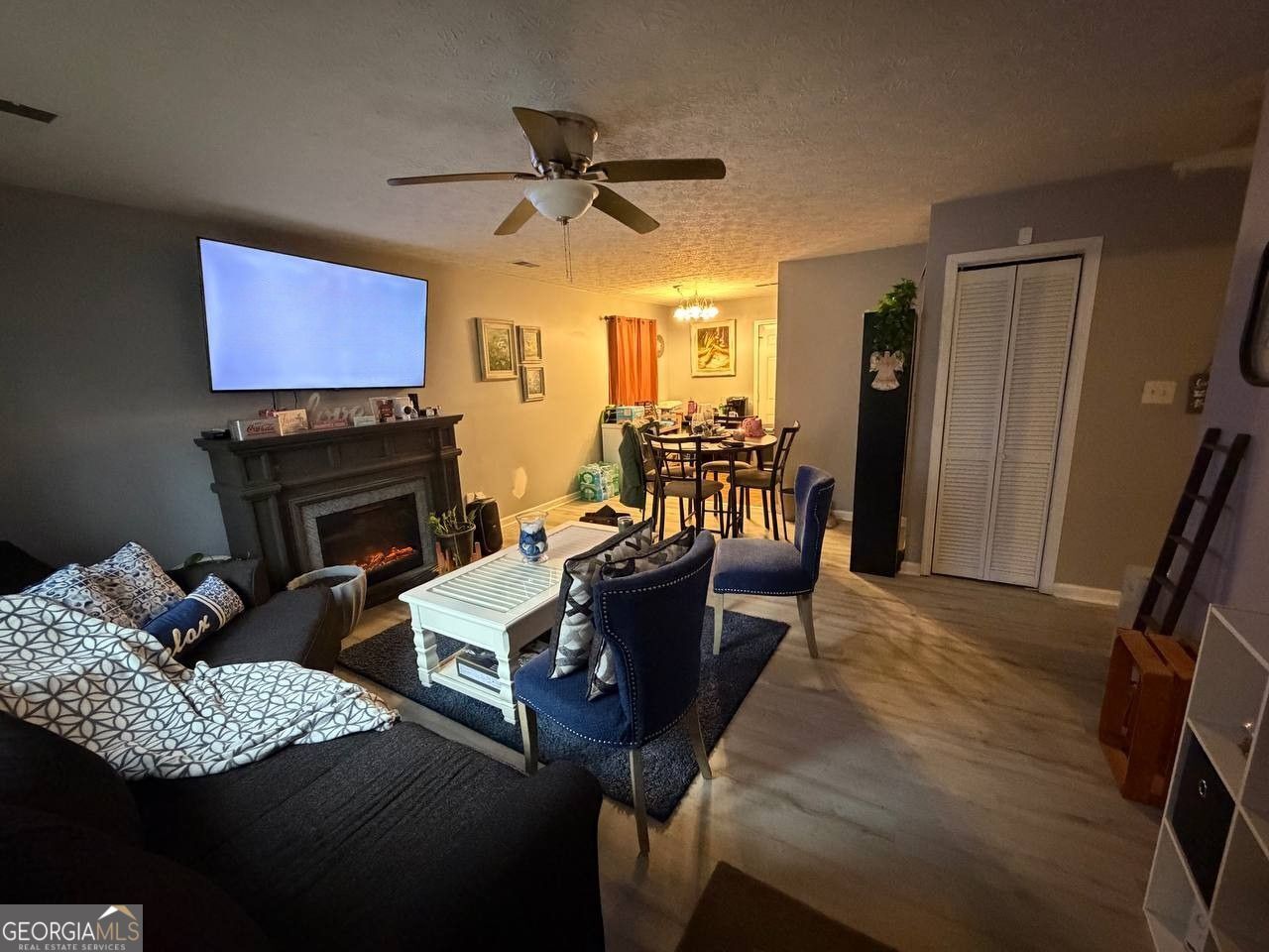 1137 Reed Place Monroe, GA 30655 - Photo 2 of 10 a living room with furniture and a flat screen tv